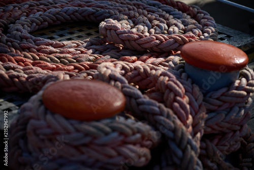Close up view of thick coiled mooring rope on a wooden ship deck, Gdynia, Pomerania, Poland, Europe