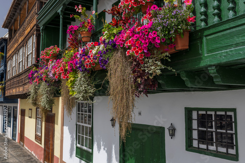 The Balcones de la Avenida Maritima, town houses with wooden balconies decorated with colourful flowers in Santa Cruz de La Palma, the capital of La Palma, Canary Islands, Spain.