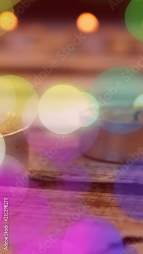 Animation of spots of light over christmas tea lights