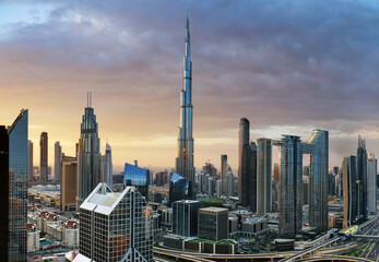 Fotobehang Burj Khalifa Dramatic sunrise over Dubai skyline panorama with Burj Khalifa and luxury skyscrapers, United Arab Emirates  © TTstudio
