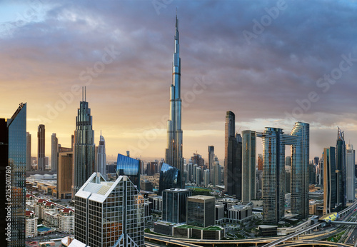 Dramatic sunrise over Dubai skyline panorama with Burj Khalifa and luxury skyscrapers, United Arab Emirates
