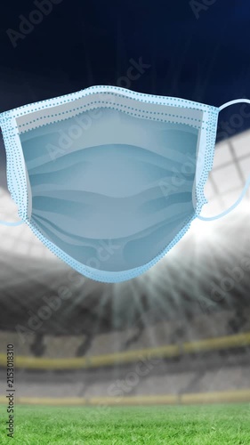 Animation of covid 19 signs and face mask over sports stadium