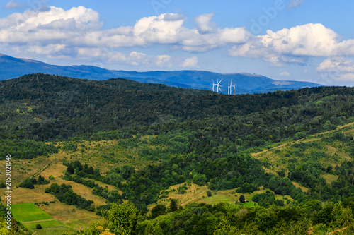 Wind turbines among the Carpathian Mountains. Ecological energy concept in Ukraine