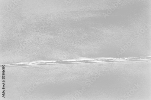 фотографія Folded paper texture with frayed torn diagonal crease