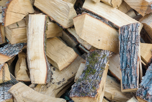 Stack of chopped firewood with natural wood texture. Chopped firewood