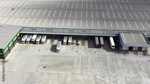 Aerial view of a truck leaving loading docks at a warehouse