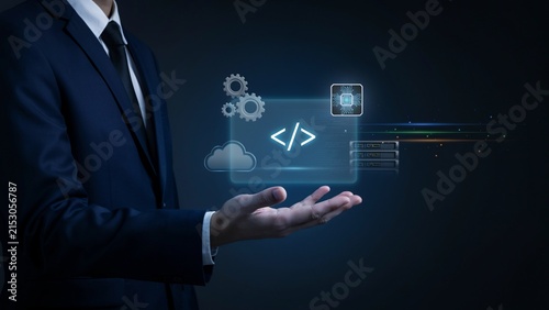 Businessman holding glowing digital coding and technology