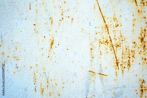 Weathered metal texture with rust spots and scratches