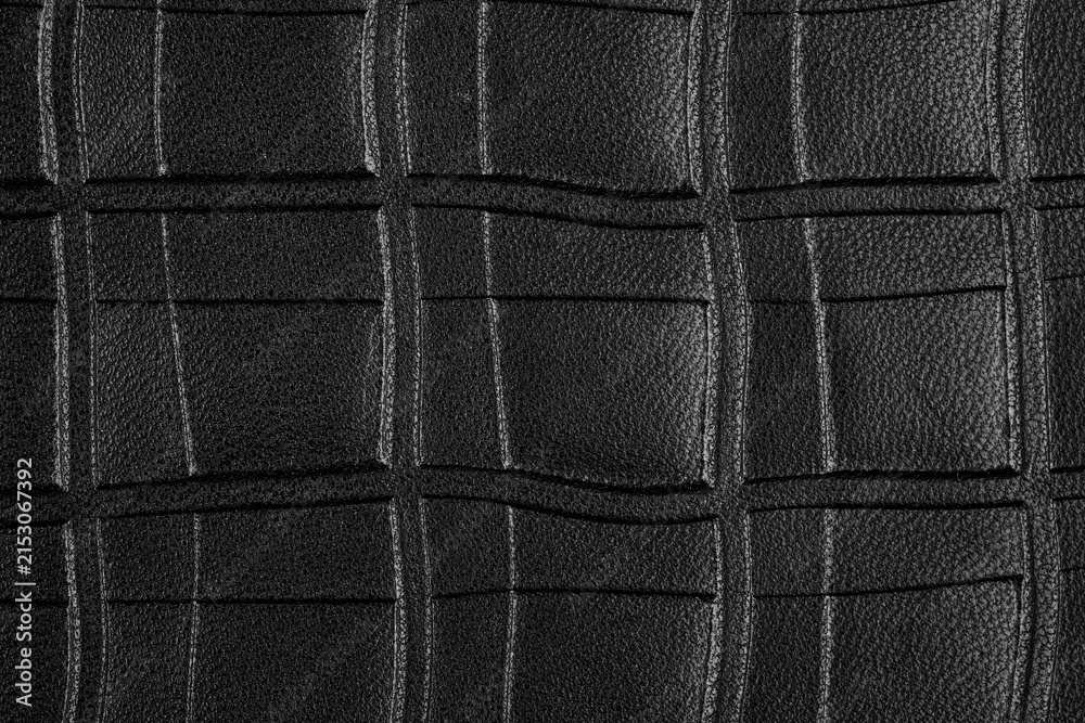 Naklejka premium Macro shot of black leather texture with quilted pattern
