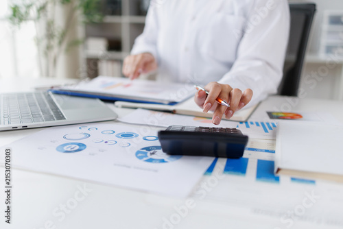 Business doing finances and calculating financial report with business graph growth chart, finance and investment Business Financing Accounting Banking Concept.