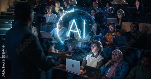 Принти на полотні Rear View of a Professor Gesturing Toward a Glowing Ai Hologram Sphere While Lecturing Attentive Multiethnic University Students Working on Laptops in a Dark Tiered Auditorium Classroom