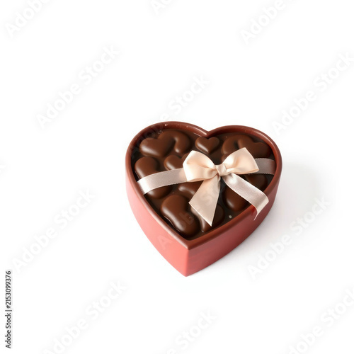 Elegant heart-shaped chocolate box filled with assorted dark chocolates and adorned with a delicate satin ribbon, perfect for gifting on special occasions