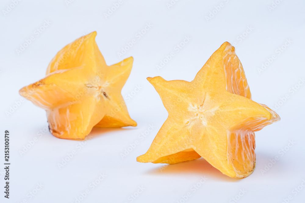 Fototapeta premium Fresh Ripe Starfruit Slices Isolated on White Background