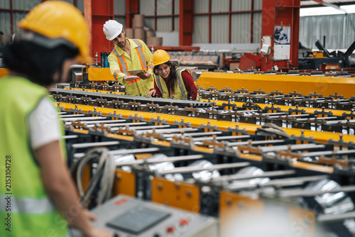 Industrial Technician Assessing Steel Manufacturing Process in Factory