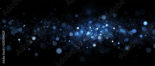 Canvastavla Blue bokeh lights and glowing glitter trail on dark background