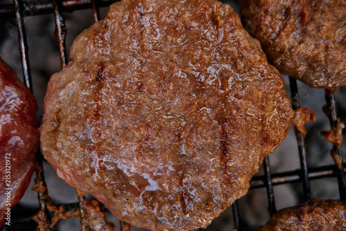 Juicy Burgers Grilling on Outdoor BBQ