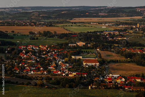 Scenic aerial view of Unterwellenborn surrounded by nature at dusk
