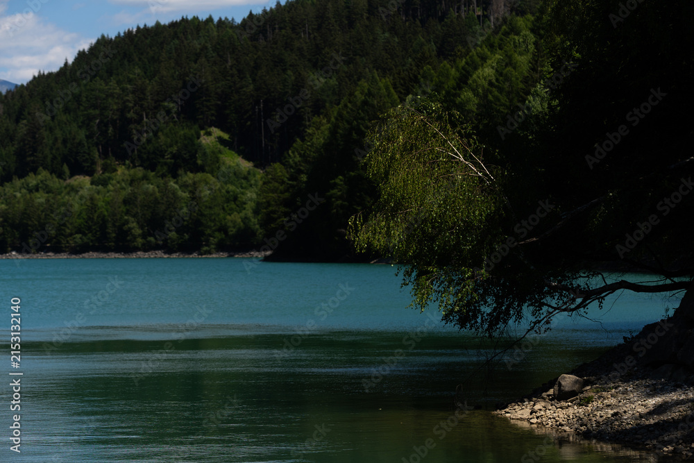 Obraz premium Peaceful Lake With Mountain, Tranquil Alpine Landscape With Shimmering Waters And Slopes