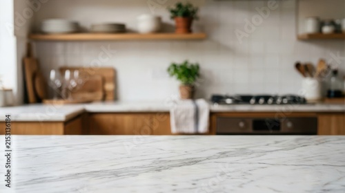 Elegant blurred kitchen background showcasing a pristine marble countertop in the foreground and modern culinary amenities. Stylish cooking space.