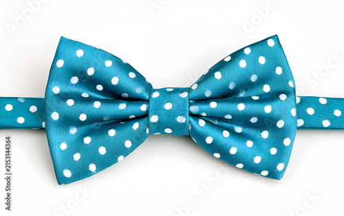 Stylish blue bow tie with white polka dots isolated on white background. Fashion accessory for men. Concept for party or celebration outfit, elegant event.