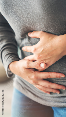 Young woman with stomach ache