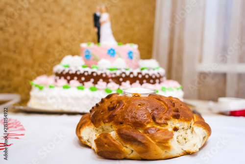 A traditional wedding loaf and a tiered festive cake