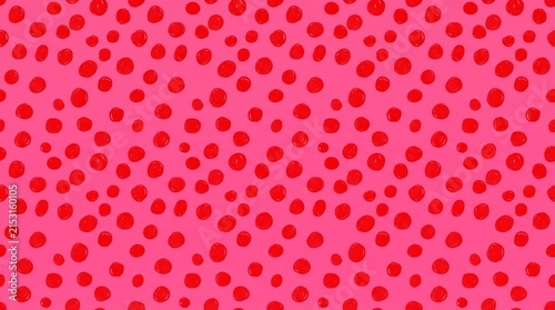 Vibrant red polka dot pattern texture on fabric.
