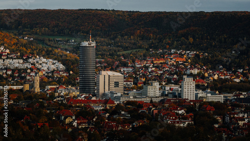 Aerial view of Jena city skyline with Jentower surrounded by colorful autumn forests