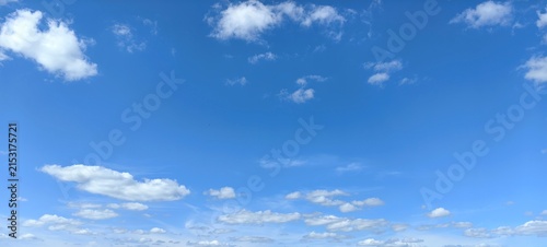 Blue sky with white clouds, natural background.
