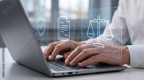 Law and justice concept with digital icons over laptop