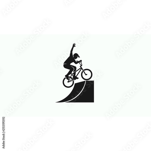 Extreme bmx rider performing a stunt jump off a ramp