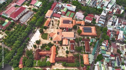Daytime Drone Hyperlapse Orbit Around the Bishop's Palace of Buon Ma Thuot Diocese, Aerial View of Catholic Religious Architecture and Historic Landmark in Dak Lak, Vietnam