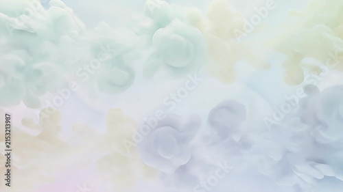 Colorful ink smoke on pastel background.