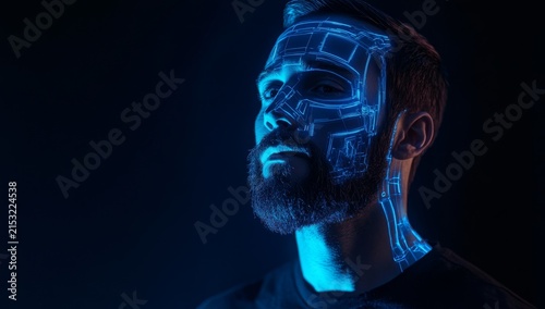 A handsome man with a beard, wearing a black shirt and a blue, glowing robotic face in a sci-fi style, cinematic shot, captured with an ARRI Alexa 