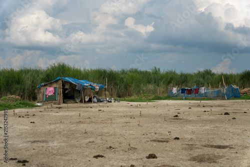 Obraz na płótnie Simple Rural Hut on a Sandy River Char in Bangladesh