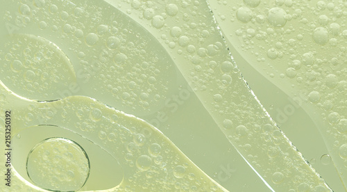 Abstract Green water bubbles essential oil beauty collagen Serum Repair cell background.
