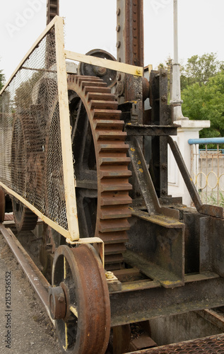 Konstfotografi Close up of old rusty metal gear wheel and mechanism on rails on Korsun Shevchenkivskyi hydroelectric dam, vintage industrial machinery backdrop