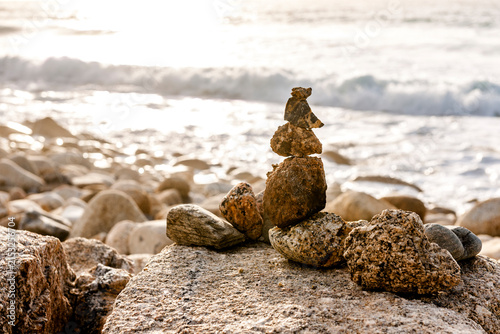 A stone cairn decorates the beach at Whitesand Bay in Cornwall