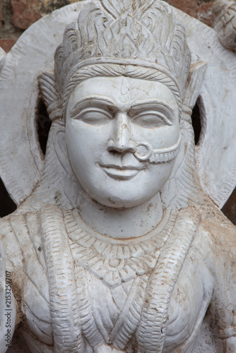 Marble statue of a Hindu goddess with crown and nose ring