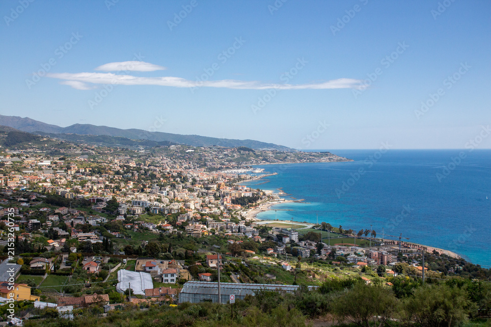 Fototapeta premium Scenic Seaside Landscape with Blue Water and Distant Hills