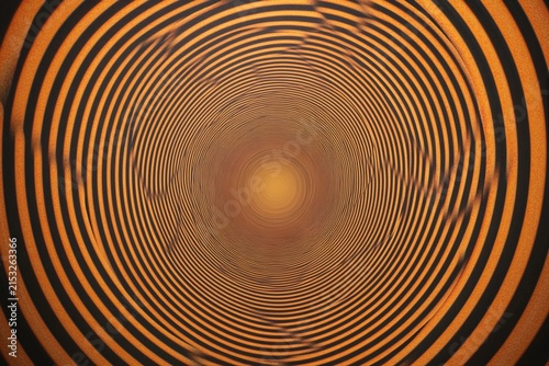 Circles flow and create an illusion of depth within a structured tunnel-like formation