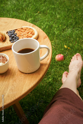 breakfast in the garden with a cup of coffee