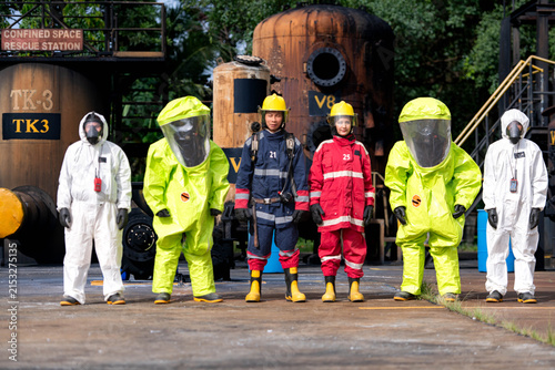 Emergency response workers in chemical protective suits during a hazardous materials training exercise