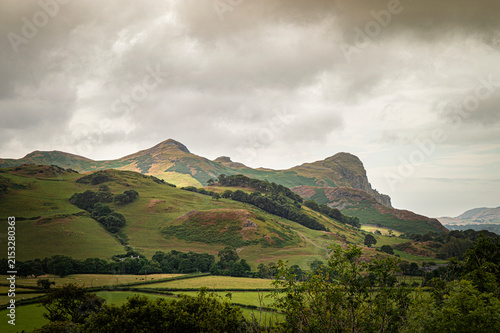 Welsh mountains beneath grey sky dramatic overcast landscape rugged peaks