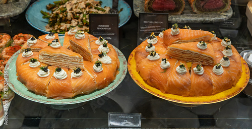 Smoked salmon crepe cake features delicate thin crêpes or pastry layers filled with cream cheese, cream, and smoked salmon.