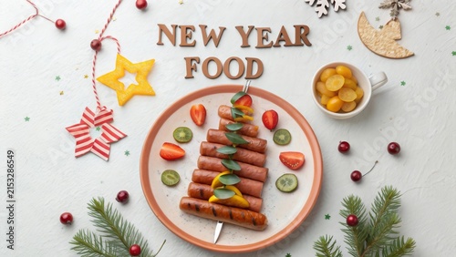 Creative edible Christmas tree made from grilled sausages with colorful toppings for festive celebrations