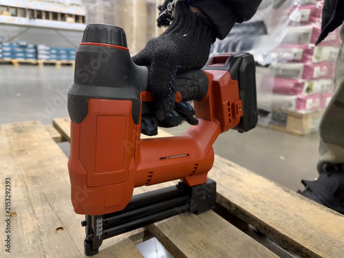 Cuadro en lienzo A Close-Up View of a Battery-Powered Nail Gun Being Used on a Wooden Pallet in a
