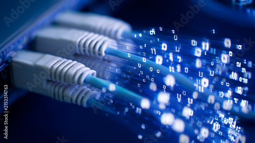 Close-up of Fiber Optic Cables Transmitting Digital Data with Blue Light.