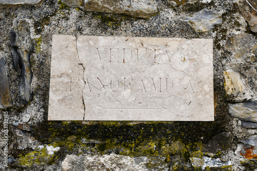 Bild auf Leinwand Ancient marble plaque with Italian text Veduta Panoramica (Panoramic View) carve