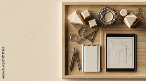 Wooden desk organizer with geometry set paper notepad drawing compass and digital tablet for architectural design.